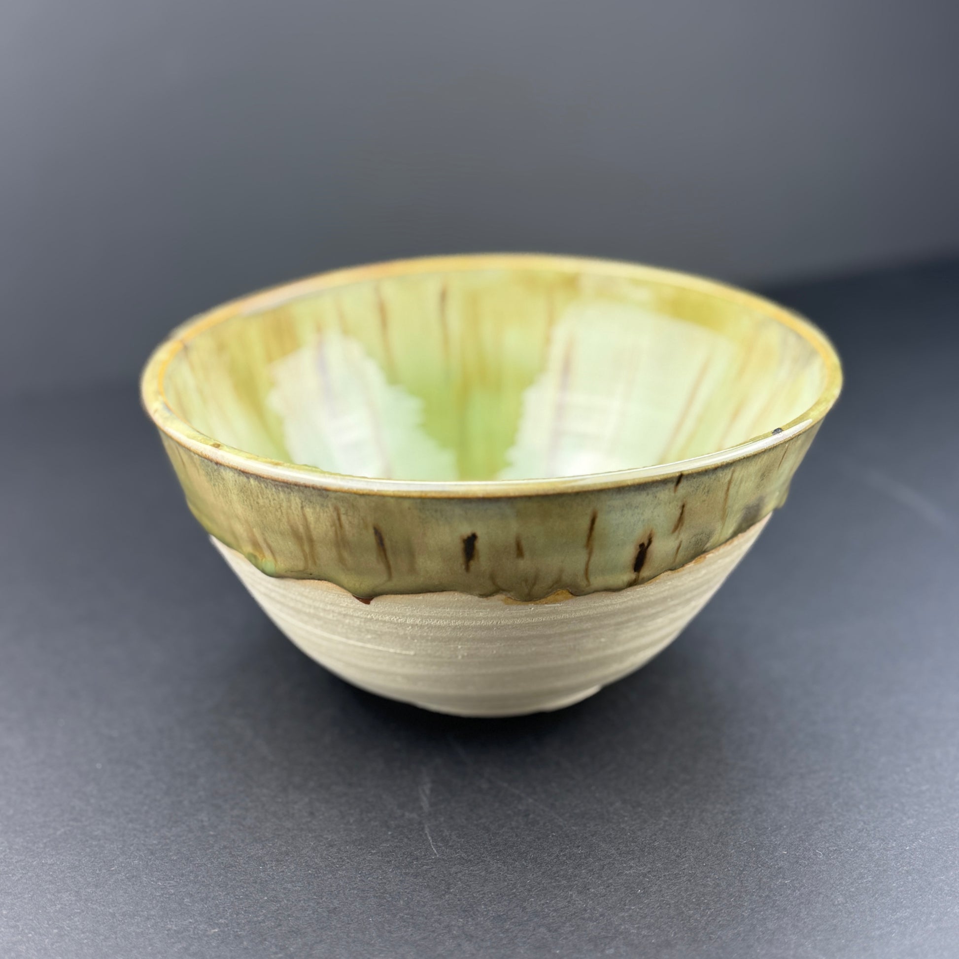 Deep medium bowl with gorgeous green flowing glaze