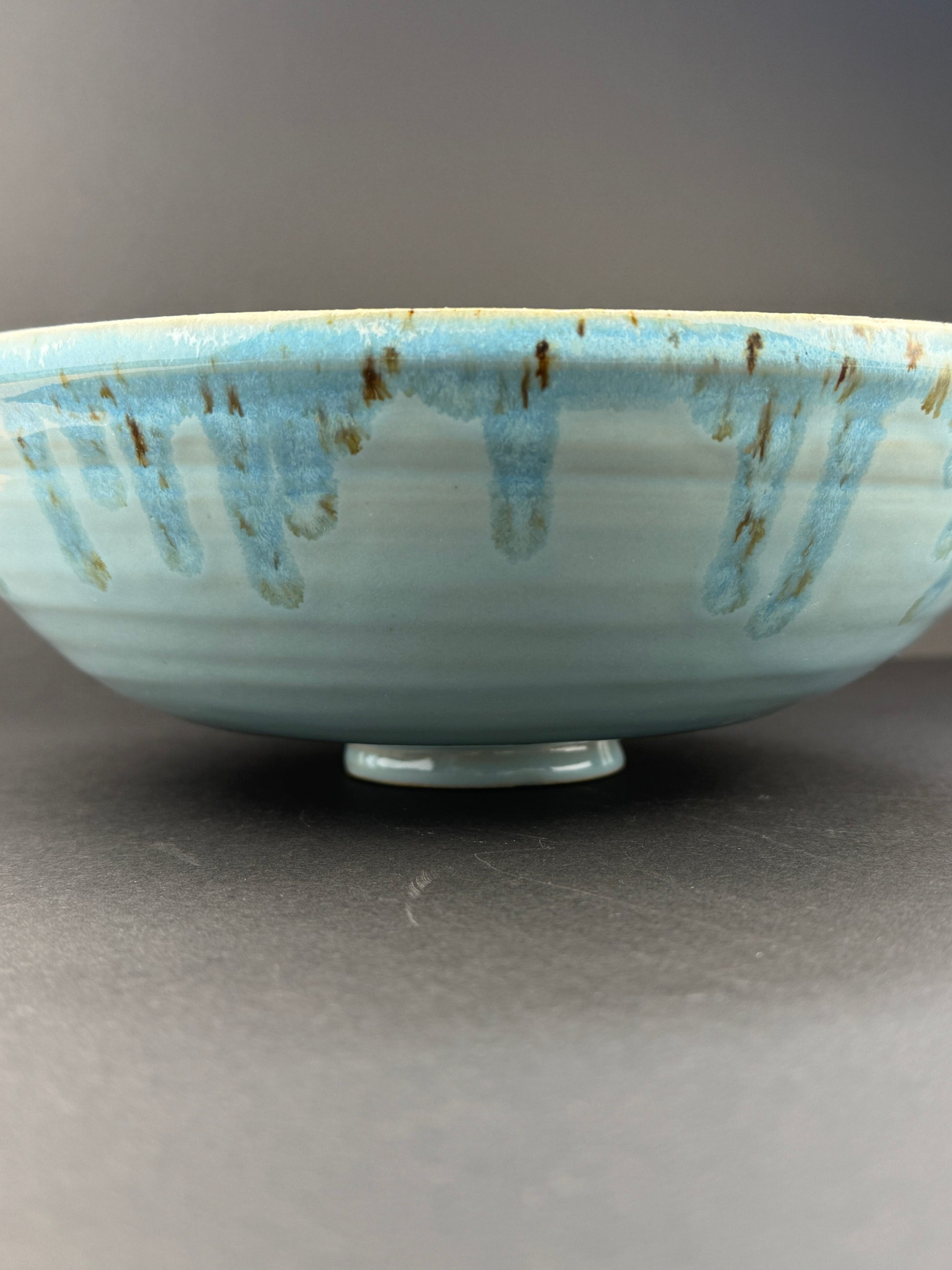 Large bowl with flowing turquoise glaze