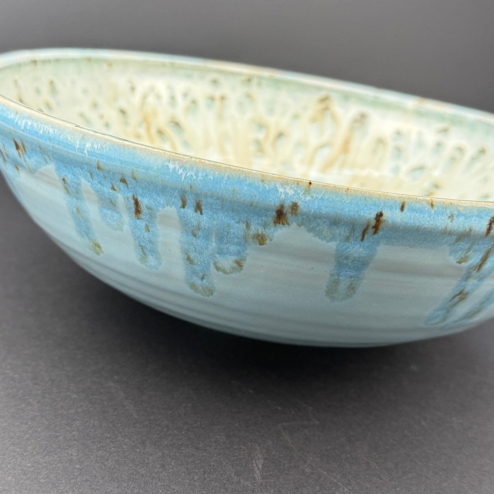 Large bowl with flowing turquoise glaze